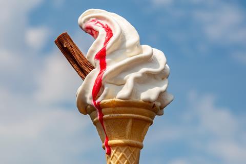 ice cream cone with flake and strawberry sauce